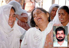 Balwinder Kaur, widow of farmer Gurdev Singh, mourns along with her relatives at Batala village in Kapurthala on Monday