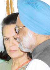 Prime Minister Manmohan Singh and AICC President Sonia Gandhi arrive for a joint press conference at Haryana Bhavan in Chandigarh on Saturday