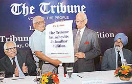 Justice R.S. Pathak (standing right), President of The Tribune Trust, and Mr H.K. Dua, Editor-in-Chief, launch the Jalandhar edition of The Tribune on Friday. Also seen are Mr R.P. Bambah (left) and Justice S.S. Sodhi, Trustees of The Tribune Trust. 