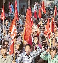 Workers protest against the closing down of two cycle units in Ludhiana on Thursday. 