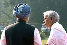 Natwar Singh with Prime Minister Manmohan Singh at Rashtrapati Bhavan barely a few hours before he was stripped of the External Affairs portfolio in Delhi on Monday. 