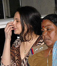 Monica Bedi, Bollywood actress and girlfriend of underworld Don Abu Salem, is brought to the CBI office in Hyderabad on Friday night.