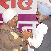 Dr Manmohan Singh greets Chaudhary Ranbir Singh, veteran freedom fighter, member of the Constituent Assembly and father of Haryana Chief Minister Bhupinder Singh Hooda on the occasion of his 92nd birthday in New Delhi on Saturday.