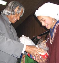 President Abdul Kalam gives gifts to a Kashmiri orphan girl during his visit to Army Headquarters in Srinagar on Saturday.