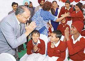 Gen (retd) S.F. Rodrigues, Governor of Punjab, greets mentally handicapped children after laying the foundation stone of the Regional Institute for Mentally Handicapped in Sector 31, Chandigarh