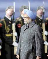 Prime Minister Manmohan Singh inspects Russian honour guards upon his arrival at Vnukovo II airport outside Moscow on Sunday.