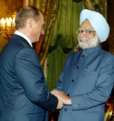 Prime Minister Manmohan Singh shakes hands with Russian President Vladimir Putin at the Kremlin in Moscow