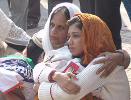 Grief-stricken mother and widow of H.P.S. Pannu in Amritsar on Wednesday.