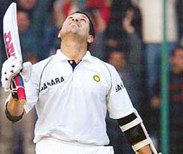 Sachin Tendulkar prays to God after his century during the first day of the second Test match against Sri Lanka in New Delhi