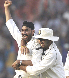 India’s Harbhajan Singh celebrates the dismissal of Sri Lanka’s Kumara Sangakkara with teammate Yuvraj Singh, during the second day of the third and final Test match between India and Sri Lanka at the Sardar Patel Gujarat Stadium in Ahmedabad, on Monday. At the end of the day’s play India were all out for 398 runs and Sri Lanka had scored 131 runs for the loss of five wickets, out of which four were taken by Harbhajan Singh.