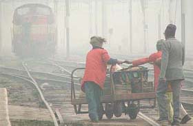 A train arrives at Amritsar railway station. Fog in the region has adversely affected schedule of several trains