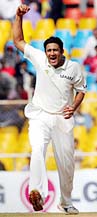 India's Anil Kumble celebrates after dismissing Sri Lanka's Kumar Sangakkara
