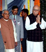 BJP President L. K. Advani and former Prime Minister Atal Bihari Vajpayee arrive at the BJP national executive meeting