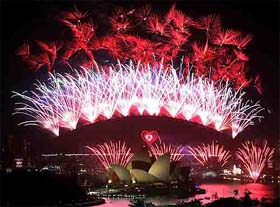 Fireworks explode above a heart-shaped design on the Sydney Harbour Bridge during a New Years fireworks display