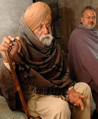 Ex-guardsman Sewa Singh (left) along with his son Hari Sharan at his home in Harpala village near Patiala on Tuesday.