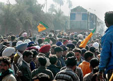 Agitating farmers block an express train outside Kashipur in Udham Singh Nagar 