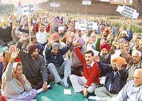 Residents of Karoran, Nayagaon and Kansal villages protest against the failure of the state government to implement NAC notification in Nayagaon on Sunday.