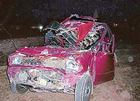 The mangled remains of the Maruti car which met with an accident, killing six members of a family from Mohali, in Pathankot