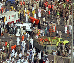 Bodies of pilgrims being removed in Mena outside Mecca on Thursday. At least 345 persons were killed in crowding during the stoning ritual at the Haj pilgrimage on Thursday, Saudi officials said. 