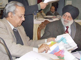 Delimitation Commission Chairman Justice Kuldeep Singh and Election Commissioner N. Gopalaswami look at a map submitted to the Commission in Bathinda.