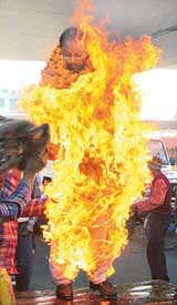 Gopal Kashyap, president of the Rajiv Gandhi Prontha Market Union, Patiala, attempts self immolation near the railway station in Patiala on Tuesday