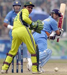 Sachin Tendulkar executes a stroke past the Pakistani wicketkeeper on way to his century in the first one-day match between India and Pakistan in Peshawar on Monday. India lost the match by seven runs.