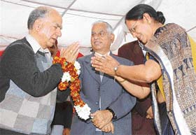 A former Mayor, Ms Kamla Sharma, greets Mr Shanta Kumar, BJP Vice-President, at a function in Mauli Jagran