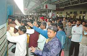 Candidates, who were in the city to appear in a test conducted by the Railway Recruitment Cell, Northern Railway, jostle to board a train at the Chandigarh Railway Station