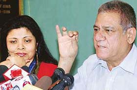 Om Puri addresses a press conference at Press Club, Chandigarh, on Monday. His wife Nandita is seated beside him