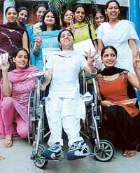 Physically challenged Anjali Gulati, BA final-year student, who got a special prize at the annual prize distribution function of MCM DAV College, with other prize winners on Thursday.