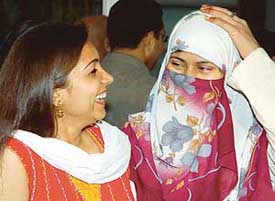 An MBA student from Pakistan, Habiba, shares a light moment with a Panjab University student after reaching Chandigarh to take part in Jhankar- 2006 on the university campus on Thursday.