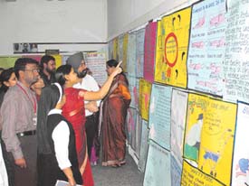 Dr Baldeep Singh at the poster exhibition during the workshop on ageing organised by nursing students of CMCH in Ludhiana on Friday