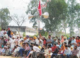 Loudspeakers installed at the venue of rural sports meet in Bhadowal village with Government Senior Secondary School in the background