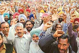 The Democratic Employees Front, Punjab, protests at Sector 17, Chandigarh, on Tuesday.