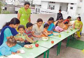 Students of Whizkid and their mothers participate in a recipe contest held at the school in Ludhiana on Friday