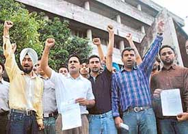 PUSU activists protest outside the venue for the Syndicate meeting at Panjab University, Chandigarh, on Saturday.