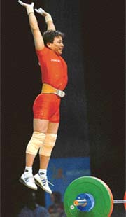 Indias Kunjarani Devi Nameirakpam jumps in the air after winning the gold medal in the 2006 Commonwealth Games womens weightlifting 48 kg category in Melbourne, Australia
