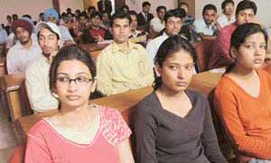 Students of GGDSD College, Sector 32, Chandigarh, attend a seminar on IT at their college on Monday.