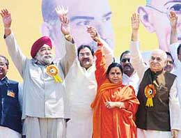 Mr H.S. Balli, former Industry Minister of Delhi, Mr Abhay Chautala, Ms Uma Bharti and Mr Madan Lal Khurana wave to their supporters at Janadesh Rally at Ramlila Ground in New Delhi on Tuesday.