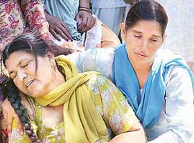 Grieving relatives after the violence in which two persons were killed and 13 injured in a clash in Amritsar
