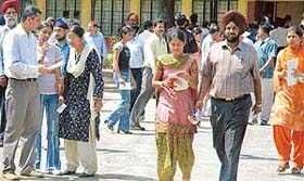 Students come out of the examination centre at St. Anne’s School, Sector 32, Chandigarh, on Sunday after appearing for PMT test