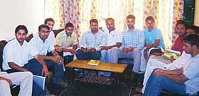 Leaders of the rival faction of the PAUSA sit inside the union office in Ludhiana