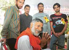 Having won their fight against drugs after a fortnight-long camp, former addicts enrolled with Upkaar await their families to take them home at Sujjon village in Nawanshahr district on Friday