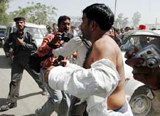 Mohd Abbas, a local Samajwadi Party leader, runs as he is chased by angry relatives of those killed in the Meerut fire tragedy on Tuesday