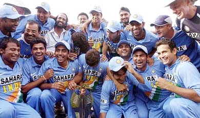 Team India poses for photographs with the trophy after winning the seventh and final one day international against England at Usha Raje Stadium, in Indore on Saturday