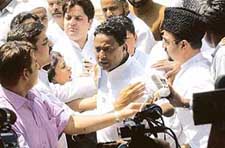 A member of the Muslim delegation being pacified by mediapersons after a scuffle broke out between the waiting journalists and the Imam Bukhari and his delegation outside the Prime Ministers residence in New Delhi on Tuesday