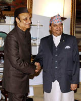 King Gyanendra shakes hands with Prime Minister Manmohan Singhs Special Envoy to Nepal Karan Singh during an audience at the Royal Palace in Kathmandu on Thursday