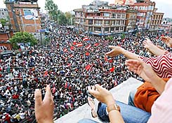 Nepalese pro-democracy activists celebrate after Nepals King Gyanendra announced the end of 14 months of absolute rule and restored Parliament which was dissolved in 2002, in Kathmandu, on Tuesday. 