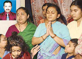 Grief-stricken family members of K. Surya Narayana (inset), the Indian engineer who was kidnapped by the Taliban in Afghanistan, in Hyderabad on Saturday.