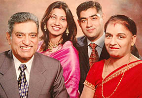 A file picture of Capt Sumit Kohli (right) with his wife Deepika and parents.